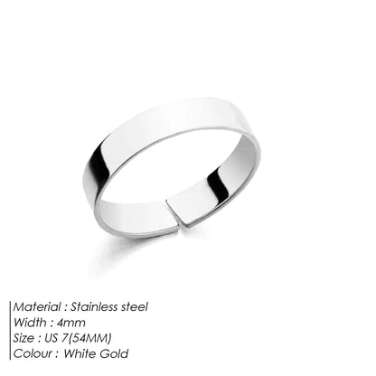 A polished titanium steel ring with a simple, open-mouth design, featuring a 18K Gold electroplated finish.