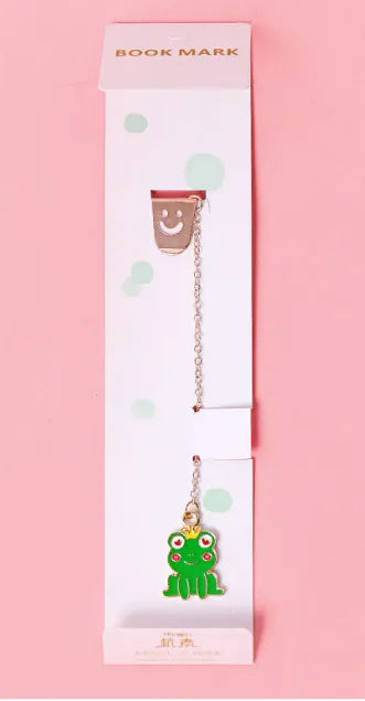 A packaged bookmark with a cute ghost-shaped charm on a pink background.