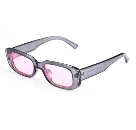 A pair of square-shaped sunglasses with a sleek frame design, featuring pink lenses and a transparent frame.