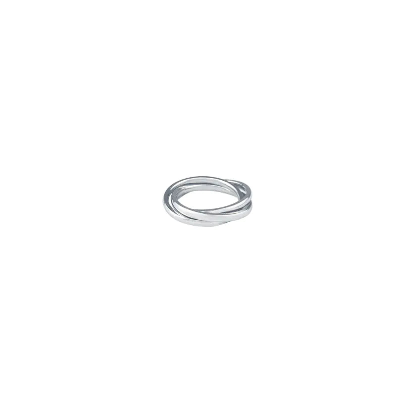 A three-ring interlocking ring made from titanium steel, displayed against a white background.