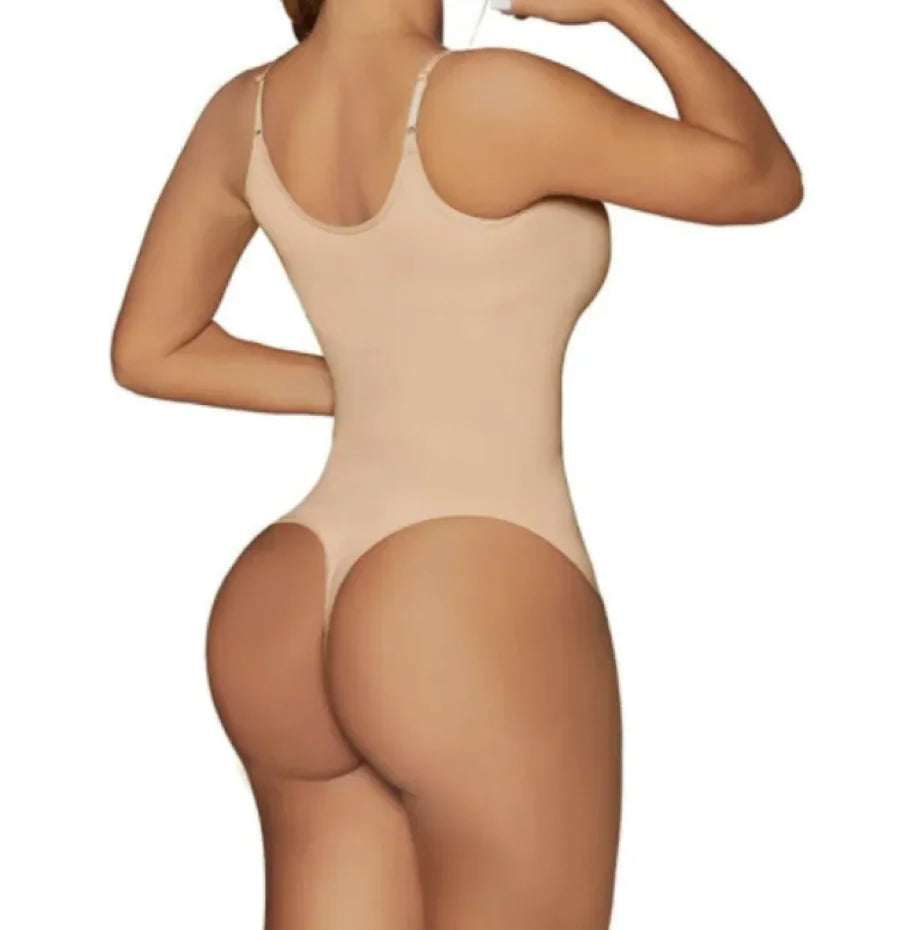 A woman wearing a black seamless corset with adjustable straps.