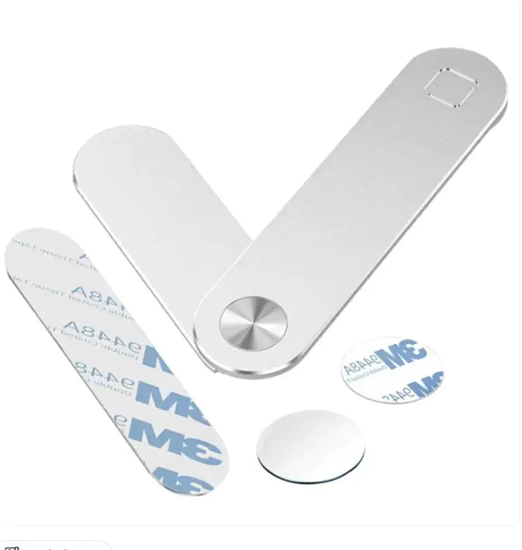 A silver laptop phone holder with a magnetic connection, capable of being retracted and released easily. It's shown in a folded position next to a laptop.