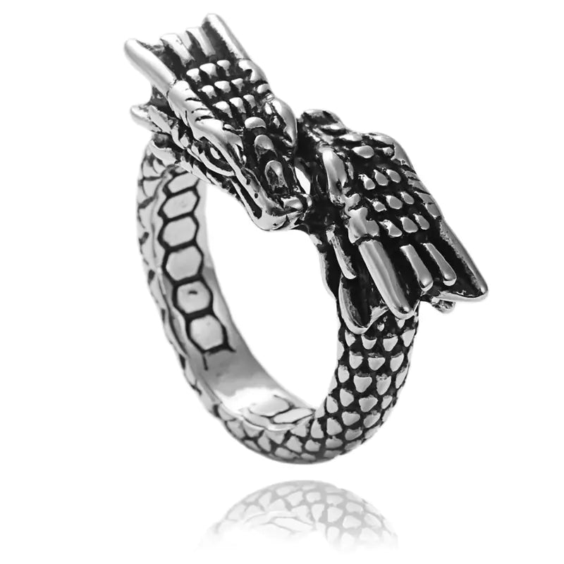 A retro-style titanium steel ring with a detailed dragon design, featuring a polished steel color and intricate text elements on the ring's band.