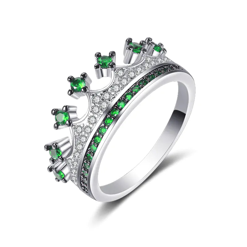A two-tone heart-shaped zircon ring with gold-plated inlaid artificial gemstones on a white background.