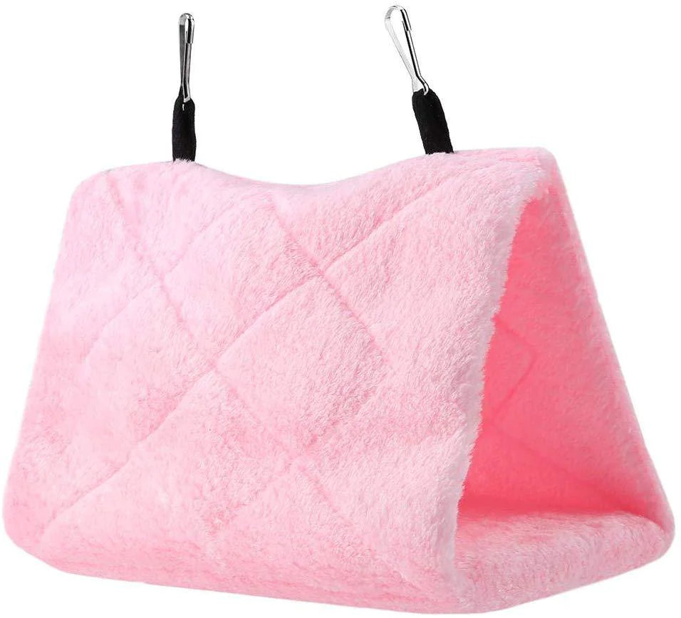 A pink cozy hammock hut tent designed for parrot cages with metal clips for hanging.