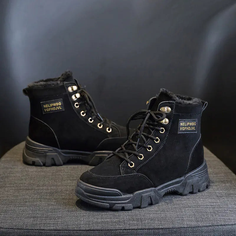 A pair of beige, short snow boots with lace-up closure and a flat heel, designed for women.