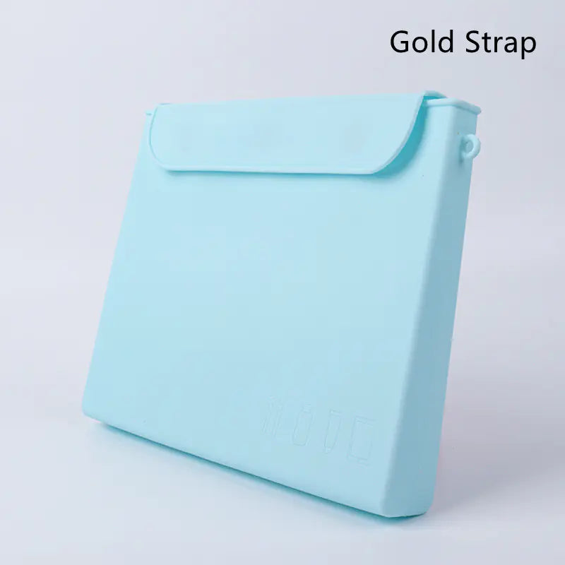 A sky blue silicone cosmetic organizer with a gold strap, displayed against a white background.